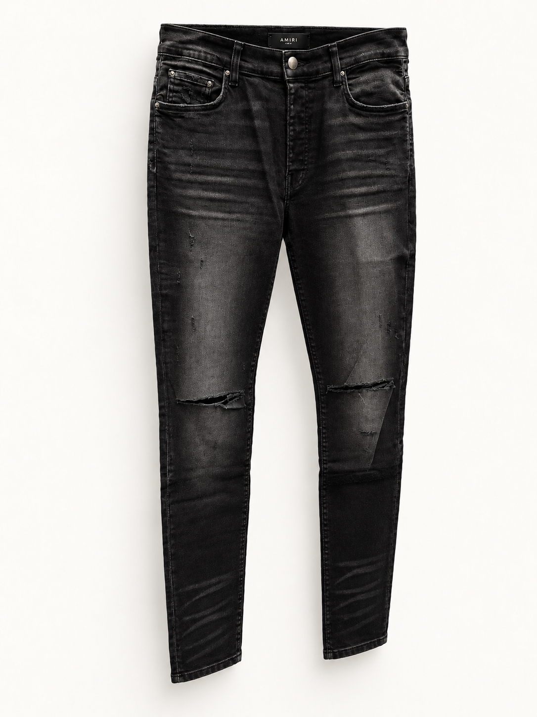Amiri Black Slash Skinny Jeans angled studio view