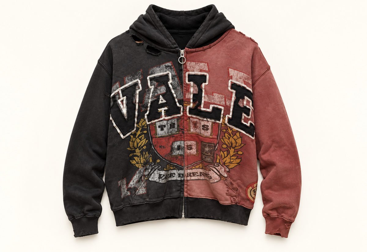 Vale black and dusty red graphic zip hoodie on a warm off-white studio background