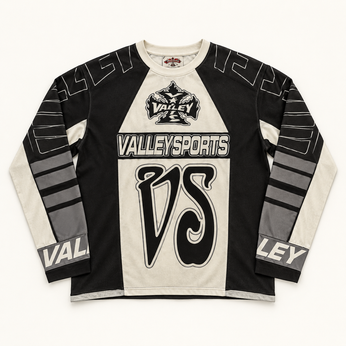 Black and cream Vale Forever Valley Sports long-sleeve tee on warm off-white studio background