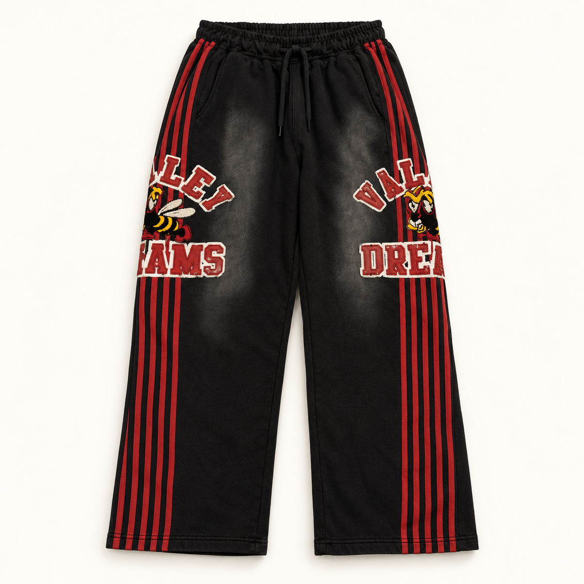 Black and red Vale Lives Bee sweatpants on warm off-white studio background